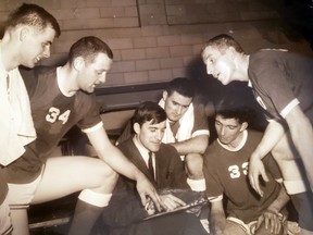 Members of the Helpert Pistons team, including Doug Evans, Don Punch, manager Bob Gray, Billy Stevens, Roy Landrye and Mel McCarthy.