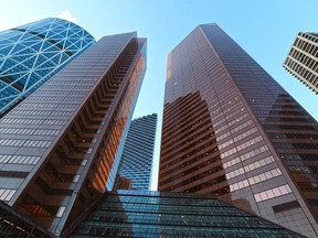 The Suncor Energy Centre in downtown Calgary. Affecting up to 2,000 jobs, the company plans to reduce its workforce by five per cent in the next six months and by between 10 and 15 per cent over the course of the next year and a half. GAVIN YOUNG/Postmedia