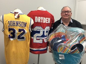 Mike Genge, president of the Children's Treatment Centre Foundation Chatham-Kent, displays some of the items that will be available to bid on during the online auction for the upcoming Festival of Giving.