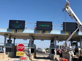 Work on new electronic signs is shown on the Canadian side of the Blue Water Bridge.
