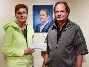 Malvina James pictured with Mayor Gord Macleod is presented with an award of $500 for winning Portrait Artist of the Year for her painting of the Mayor.