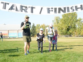 Kevin, Emery, Madelyn and Juniper Derksen start on their way as a family unit in the Moon Shadow Run on Saturday, October 3.