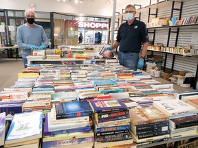 Thousands of books can be found at the 2020 Tillsonburg Rotary Book Fair at the Tillsonburg Town Centre mall, across from Shoppers Drug Mart, every Thursday to Saturday until Oct. 24. Rotary Club members Mike Donnelly, left, and John Lohuis were sorting books Friday afternoon. (Chris Abbott/Norfolk and Tillsonburg News)