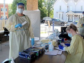 Nurse Sonia Teeuwen (left) was among the health-care workers who helped with extra COVID-19 testing conducted outdoors at a Chatham COVID-19 assessment centre in August. Chatham-Kent is among the less populated regions of Ontario still reporting low numbers as other areas struggle with a second wave. Ellwood Shreve, Postmedia Network