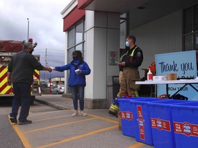 North Bay Fire & Emergency Services holds its annual Fill A Fire Truck drive outside Parker’s Your Independent Grocer, Wednesday, in support of the North Bay Food Bank. Michael Lee/The Nugget