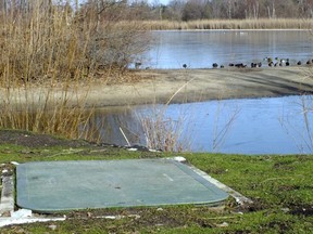 A well to help contain oil in a former landfill is pictured by Lake Chipican in Canatara Park in 2012. An investigation is currently underway to determine what upgrades to the existing containment system are needed as oil has been detected moving underground to new areas of the park. (Sarnia This Week file photo)