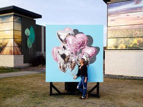 Edmonton-based artist Alixandra Jade admires her finished Instagrammable mural, one of three which is now on display at Emerald Hills Centre. The additions were created in an effort to attract new shoppers and boost visitor traffic to help support the shopping centre's businesses during COVID-19. Photo courtesy Alixandra Jade