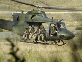 A CH-146 Griffon helicopter from 427 Special Operations Aviation Squadron based at Garrison Petawawa and part of Canadian Special Operations Force Command (CANSOFCOM), takes off after recovering troops  during a CANSOFCOM training exercise near Kamloops, BC. Sgt. Donald Clark photo