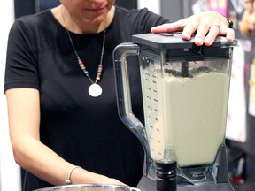 Nesreen MacDonald blends some hummus at her home in Spruce Grove Monday. The culturally Lebanese Canadian has been selling the dip and Lebanese rice pudding to raise money for those impacted by the summer explosion in Beirut since it happened in August and has raised more than $4,000 for relief efforts so far.