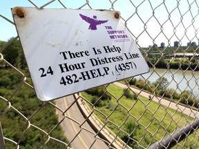 A 24 hour distress line phone number is posted on the High Level Bridge, in Edmonton.
