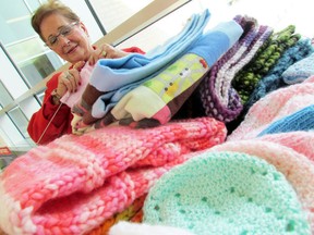 Janet Kobinski knits during a Sault Area Hospital Volunteer Association bake sale. Jeffrey Ougler/Postmedia Network