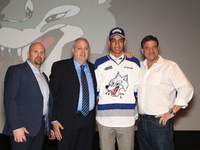 Quinton Byfield, Sudbury Wolves' first overall pick in the OHL draft, poses for a picture with Cory Stillman, left, head coach of the Sudbury Wolves, Rob Papineau, general manager of the Sudbury Wolves, and Dario Zulich, owner of the Sudbury Wolves, at a press conference in Sudbury, Ont. on Friday April 6, 2018.