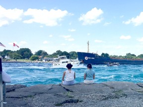 Two young women admire the mouth of the St. Clair River at Point Edward in early September. The U.S. Army Corps of Engineers report that, despite seasonal declines, water levels on the Great Lakes remained high in September. Peter Epp photo