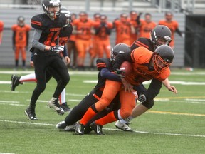 Grande Prairie Composite Warriors running back Colten Tremblay carries the ball in first-quarter action during the Warriors intrasquad game at CKC Field on Friday night. Tremblay scored two touchdowns as Team Orange and Team Black finished up in a 14-14 deadlock. The Warriors will be back in intrasquad action Friday night at CKC Field.