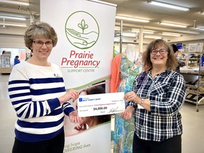 Executive Director, Mary Loewen (right) receiving the cheque after MCC Day in Portage la Prairie. (supplied photo)