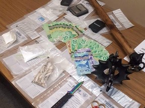 Narcotics, weapons and cash seized when police executed a search warrant at a residence in White River on Wednesday. SUPPLIED