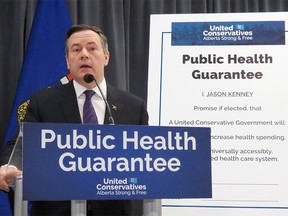 On Feb. 20, 2019, United Conservative Leader Jason Kenney unveils the broad policy plans in Edmonton for his party's health platform ahead of Alberta's election campaign. Kenney went on to sign the public health guarantee poster behind him, which outlines the UCP's promise to maintain or increase health spending and to maintain a universally accessibly publicly funded health care system. DEAN BENNETT/CP