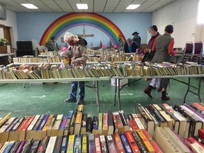 Shoppers browse through the selection of books at the Anglican Church during 2020's October installation of the Friends of the Library Book Sale.