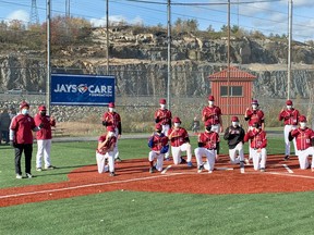 Members of the St. Charles College baseball team pose for a physically distanced championship photo after winning the SDSSAA title on Saturday.