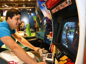 Zach Trinetti, owner of Barnetti's Arcade, plays one of the racing games at the Chatham business Oct. 19, 2020. (Tom Morrison/Chatham This Week)