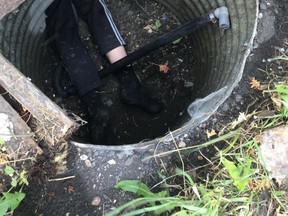The suspect was stuck in a culvert and needed assistance to be rescued before being arrested. (supplied photo)