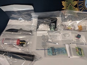 The drugs and weapons seized after Portage RCMP executed a couple of search warrants. (supplied photo)