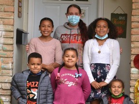 Meghan Handy (centre), a personal support worker and single mom in Stratford, has opened up about how a brush with COVID-19 has impacted her family, including children Elijah, 4, Christopher, 6, Faith, 8, Aaliyah, 11, and Kaya, 12. (GALEN SIMMONS/Stratford Beacon Herald)
