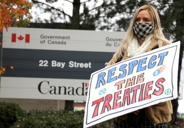 Demonstrators rally in support of Mi'kmaq fishermen in downtown Sault Ste. Marie, Ont., on Wednesday, Oct. 21, 2020. Sarah Holmberg outside federal government office on Bay Street. (BRIAN KELLY/THE SAULT STAR/POSTMEDIA NETWORK)