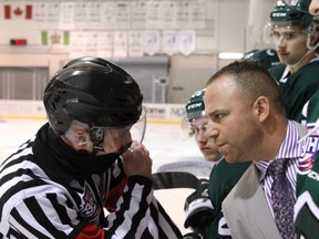 Sherwood Park Crusaders head coach Adam Manah has a chat with an official during a recent game against the Lloydminster Bobcats. Photo courtesy Target Photography
