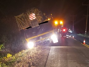 This photo posted on Twitter by the Ontario Provincial Police shows a crane that had gone off the road on Second Concession near Maitland shortly after leaving an impound yard on Wednesday, Oct. 21. (TWITTER)