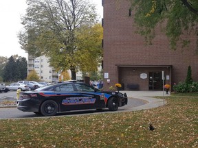 A Chatham-Kent police cruiser is shown Sunday outside a Merritt Avenue apartment building in Chatham. On Saturday, emergency crews responded to a fire at the building, where the body of a deceased person was found. The investigation is continuing. (Trevor Terfloth/The Daily News)