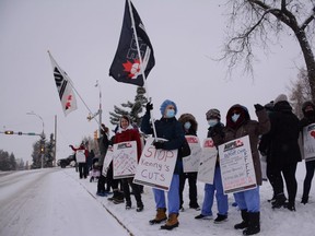 Health-care workers protest UCP cuts in front of the Queen Elizabeth II Hospital in Grande Prairie, Alta. on Monday, Oct. 26, 2020.