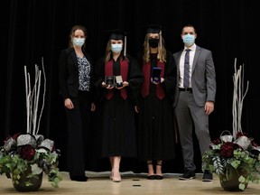 On Friday night, staff and students of the former Stratford Northwestern Secondary School participated in the school's last-ever -- and pandemic-friendly -- graduation ceremony under that school name following the recent re-organization of both of Stratford's former public high schools over the last few years. Pictured from left are Northwestern principal Emma Watts, 2020 Valedictorian Stephanie Cahill, Governor General's Award recipient Natalie Ropp, and Northwestern vice principal Derek Laidlaw. Submitted photo by Marcie Stears