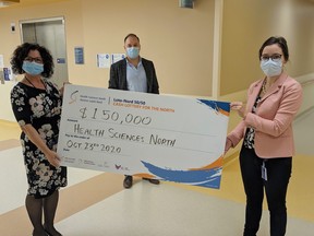 Displaying a $150,000 contribution to medical equipment through a Health Sciences North fundraising lottery are, from left, Debbie Lahti, clinical manager of the Neonatal Intensive Care Unit; Anthony Keating, president of Foundations and Volunteer Groups at HSN; and Chelsea Bartolucci, coordinator of the Breast Screening and Assessment Service. The funds will be used to purchase a new breast biopsy system and a pair of infant incubators.