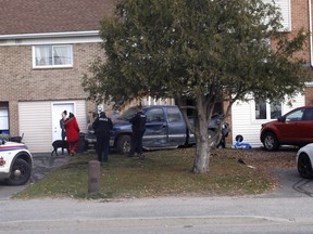 North Bay police are seen at a home on Gormanville Road, Tuesday afternoon, following a collision involving a car, pickup and SUV. Michael Lee/The Nugget