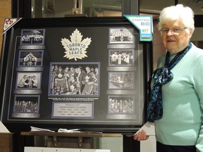 Auxiliary member Bessie Farrell stands with the new painting at the Kincardine Hospital, entitled, "Toronto Maple Leafs Dynasty". SUBMITTED