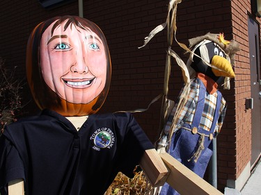 The Petawawa Pumpkin Folk version of Councillor Theresa Sabourin keeps watch with a scarecrow by the municipal officers. Anthony Dixon