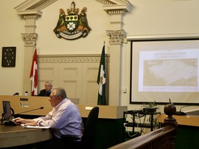Delhi councillor Mike Columbus asks a question at Police Services Board during an online presentation from the York Regional Police regarding its cannabis enforcement strategy. On the screen is a slide showing what would be classed as an indoor grow operation. (ASHLEY TAYLOR)