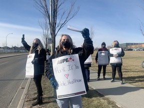 Alberta Union of Provincial Employees walked off the job as part of a wildcat strike on Monday morning, Oct. 26 at the Strathcona Community Hospital. The workers were responding to the UCP's recent announcement to cut 11,000 healthcare jobs. Lindsay Morey/News Staff