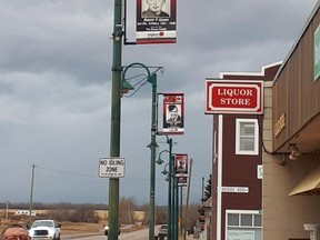 Sexsmith honours veterans by installing banners with the photographs of local veterans on light posts.