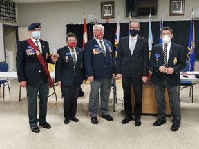 The first poppy, as part of the High River Legion Branch 71 Poppy Campaign, was given to High River Mayor Craig Snodgrass (second from right) on Oct. 26. Walter Myslicki (from left to right), Dr. Linda Ormson, Bob Collins, and President Yvone Charest just before they presented the poppy to Mayor Snodgrass.