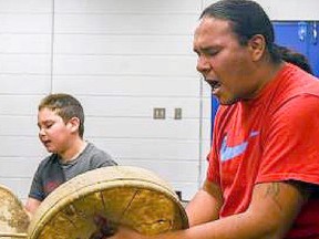 Moise Dreaver leads the drum and sing circle at the Enoch Youth Centre on Oct. 20, 2016. The
circle is open for kids wishing to learn how to drum and sing.