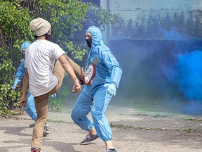 A fight scene in Disguise that occurs outside Tamara's (cartel leader's granddaughter played by Lauren Brady) studio. Sach (played by Yashraj Detha) is one of the detectives on the case to discover the cartel's secrets but unintentionally falls in love with Tamara and they are caught by surprise by intruders at her art studio. Sach is fighting off two intruders here. Josh is to his right (played by Barret Coates, actor and stunt artist) and the stunt double (Darren Ta, from 3 Takes or Less stunt team from Edmonton) is on the left. The film recently wrapped after shooting in Spruce Grove and officials sat down to talk with the Reporter/Examiner about the project.