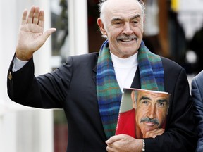 British actor Sean Connery poses for photographers as he promotes his new book, called 'Being a Scot' at the Edinburgh International Book Festival, in Charlotte Square gardens, in Edinburgh.