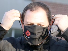 Mayor Christian Provenzano prepares to attend launch of Royal Canadian Legion Branch 25 poppy campaign at cenotaph on Queen Street East in Sault Ste. Marie, Ont., on Friday, Oct. 30, 2020. (BRIAN KELLY/THE SAULT STAR/POSTMEDIA NETWORK)