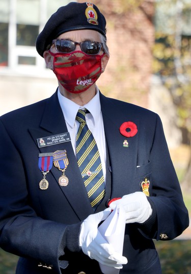 Helen Stewart prepares for launch of Royal Canadian Legion Branch 25 poppy campaign at cenotaph on Queen Street East in Sault Ste. Marie, Ont., on Friday, Oct. 30, 2020. (BRIAN KELLY/THE SAULT STAR/POSTMEDIA NETWORK)