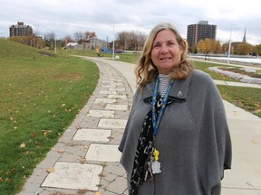 Georgette Parsons stands next to the Footsteps project in Sarnia's Centennial Park. She retired recently as chairperson of the Sexual Assault Survivors' Centre board after 25 years of service.