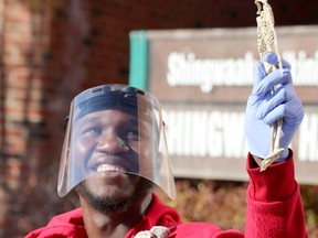Yahaya Alphonse, president of Algoma University Students' Union, has some fun during a trick or treat event for youngsters at Algoma Univeristy on Saturday, Oct. 31, 2020 in Sault Ste. Marie, Ont. (BRIAN KELLY/THE SAULT STAR/POSTMEDIA NETWORK)
