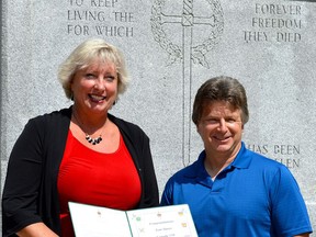 Retired teacher, local historian and author Tom Slater received a Canada 150 Sesquicentennial Service Award in 2017 from MP Marilyn Gladu for his work in putting together the Sarnia War Remembrance Project. After eight years of research, Slater has completed the final edition of his work, which tells the stories of Sarnia’s fallen soldiers.File photo/Postmedia Network