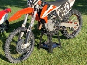 On October 27, 2020 at 5:10 a.m., the South Bruce Ontario Provincial Police (OPP) received a report on the theft of a dirt bike. Sometime between 10:00 p.m. on October 26, 2020 and 5:00 a.m. on October 27, 2020, an Orange and White KTM SXF 450 dirt bike was taken from the bed of a pick-up truck that was parked on Mitchell Street in Teeswater. The bike has the number 852 on it, there is no license plate and the serial number is on file with police. The value of the stolen dirt bike is estimated to be $14,000.